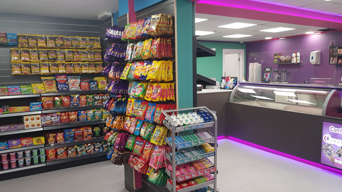 Colourful retail display of bagged sweets, snacks, and candy inside the Candy 
Cream dessert shop in Bathgate