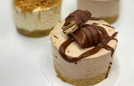 Close-up slice of rich chocolate fudge cake with ganache topping, from Candy 
Cream in Bathgate 